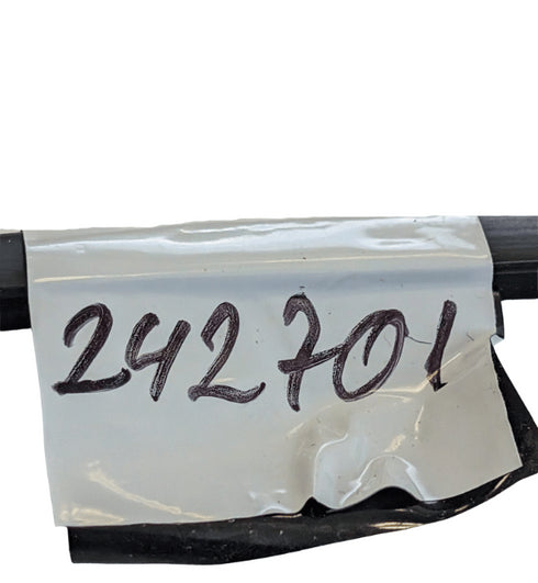 Clear plastic bag with handwritten numbers '242701' on a white background